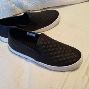 Black quilted slip on shoes